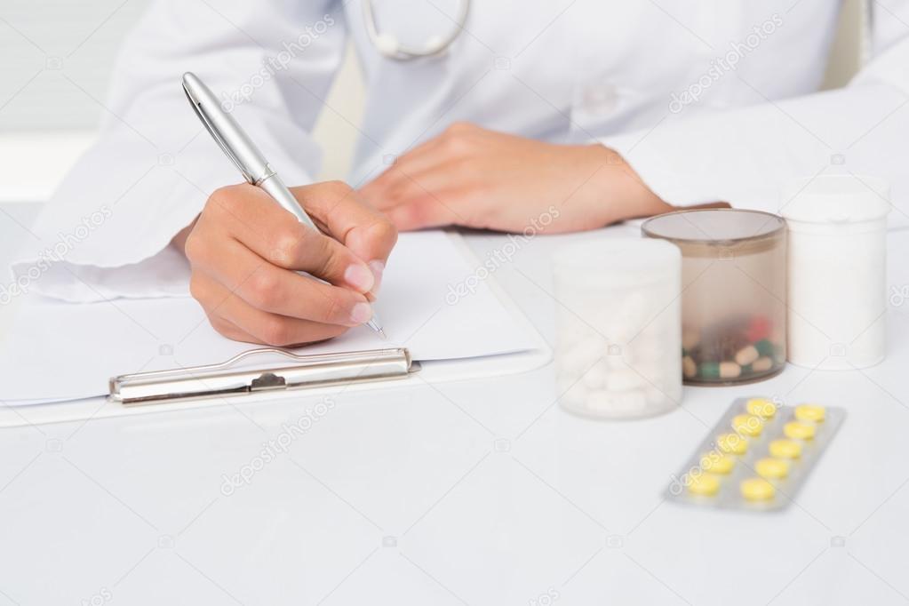 depositphotos_69008843-stock-photo-vet-writing-on-clipboard-the